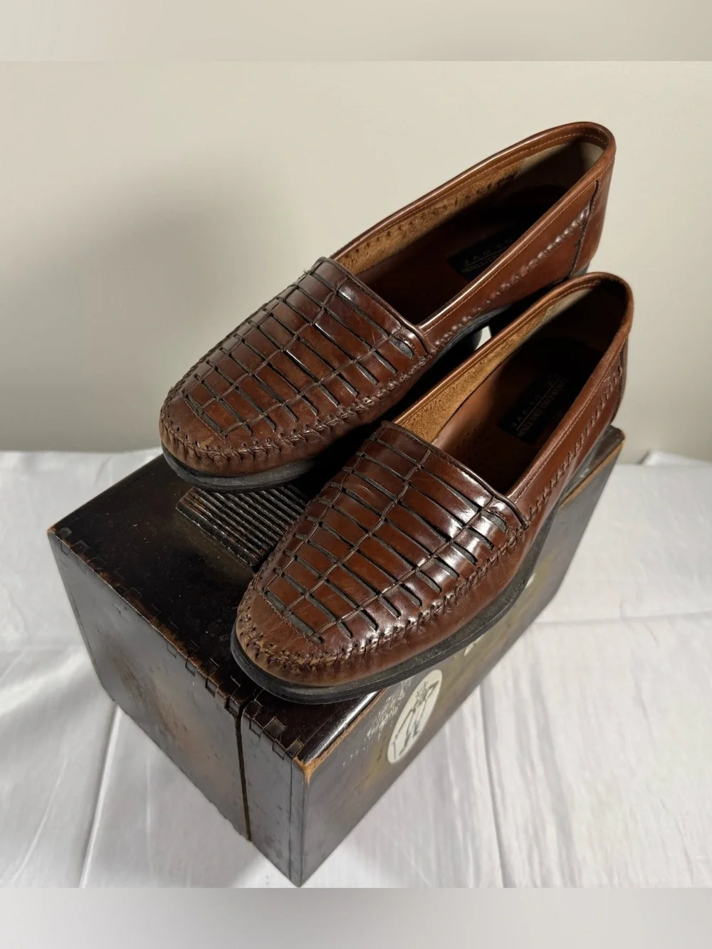 Giorgio Brutini brown leather slip-on loafers featuring a woven design